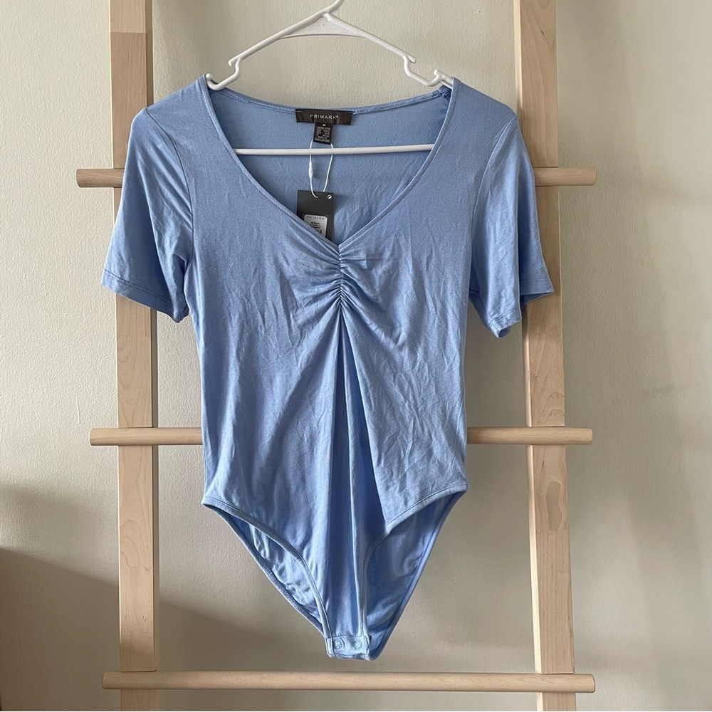 NWT Primark Baby Blue Bodysuit Tee Size Medium